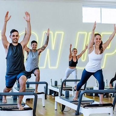 Yellow Custom Neon® pilates studio sign @upstate_studios