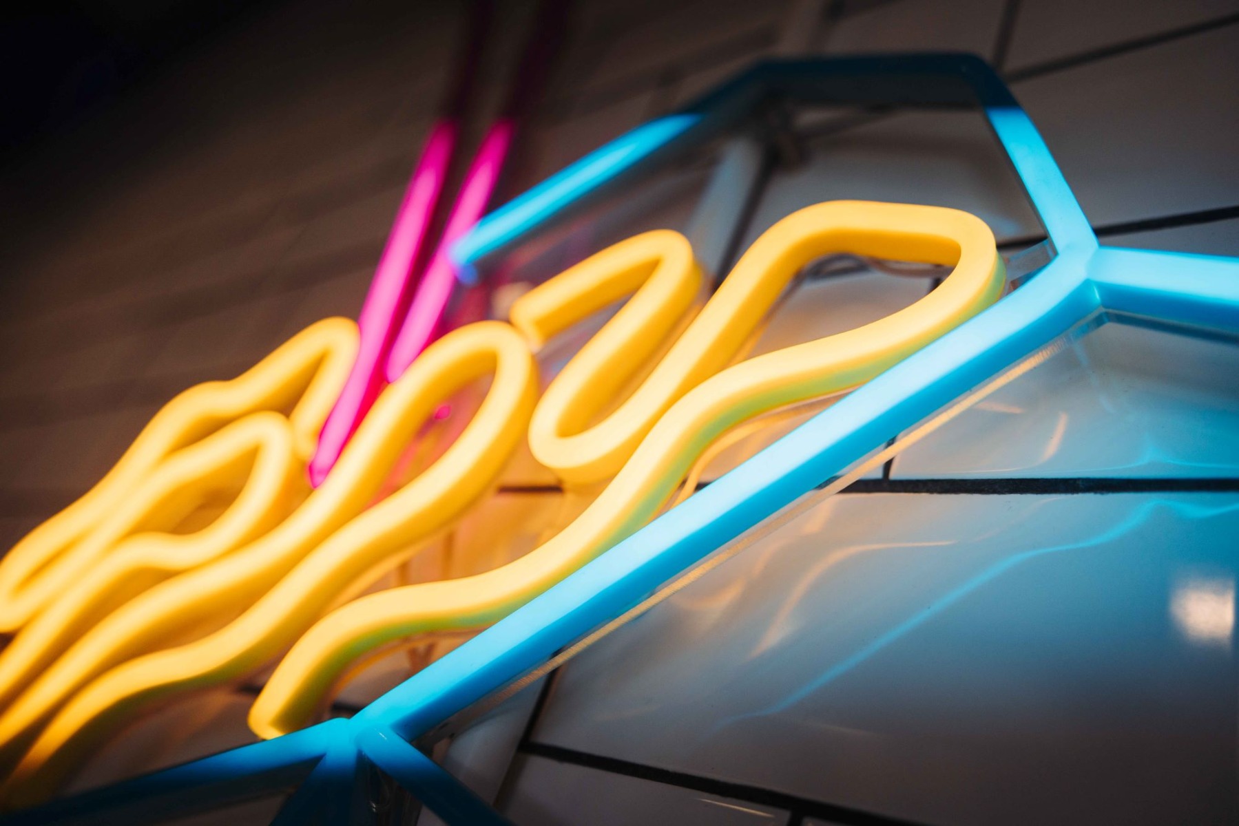 Close up of a warm white Naked Neon™ sign from Custom Neon®