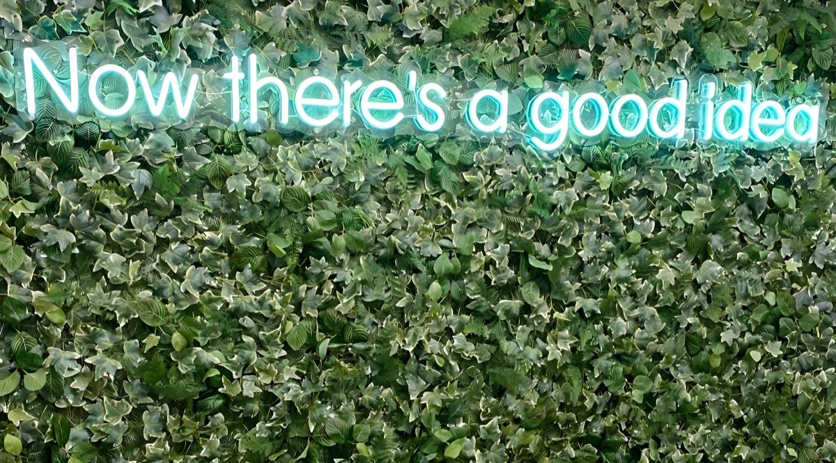 Custom Neon® Now There's a Good Idea mint coloured office sign on greenwall @hrocgroup