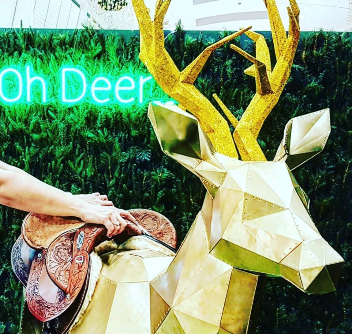 Custom Neon® green Oh Deer light sign as part of the holiday display at @rhodeswaterside shopping mall