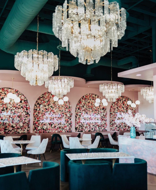 White Custom Neon® quote signs on floral walls @plateddreamscafe