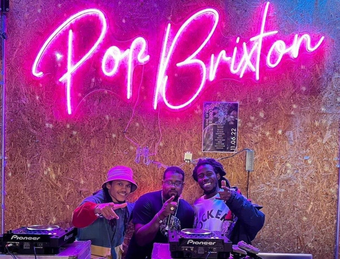 Custom Neon&reg; large pink sign behind the DJ booth @popbrixton