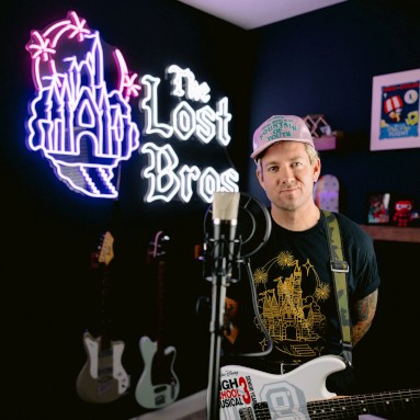 Custom Neon® tropical blue logo light sign on a flower wall @cafeomnia by 