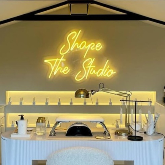 Warm white nail salon namesign by Custom Neon® @shapethestudio