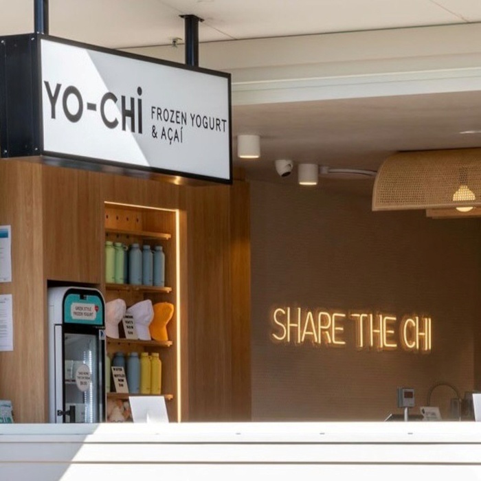 Share the Chi warm white branded wall sign by Custom Neon&reg; seen through the window @iloveyochi