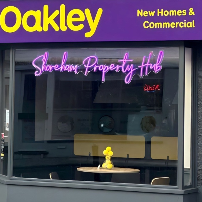Custom Neon® purple estate agent window sign at the Shoreham office @oakleyproperty