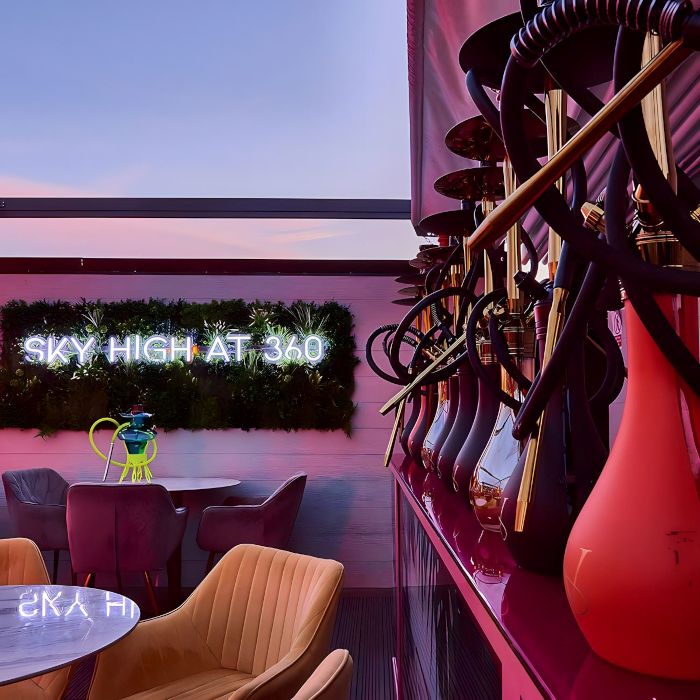 Sky High at 360 white LED Custom Neon® sign on a grasswall in the rooftop hooka lunge @360skyloungenewcastle