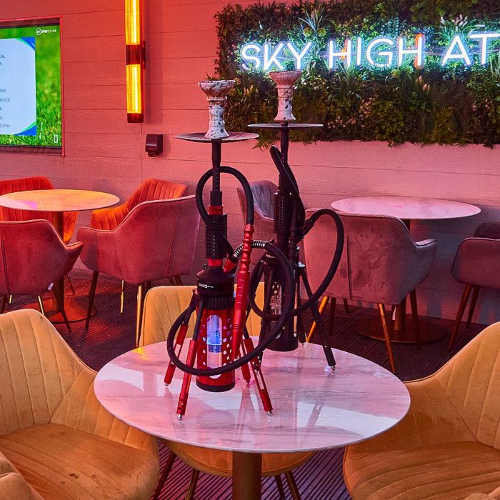 Sky High at 360 white LED Custom Neon® sign on a grasswall in the hooka lunge @360skyloungenewcastle