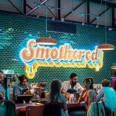 Multicolored large restaurant sign by Custom Neon® @smotheredbrunch