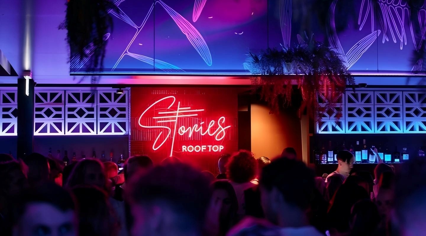 Stories Rooftop Custom Neon® sign behind the bar at the @stories.au nightclub