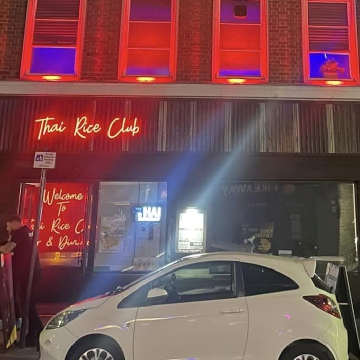 Thai Rice Club red Custom Neon® sign outside the Thai Rice Club restaurant