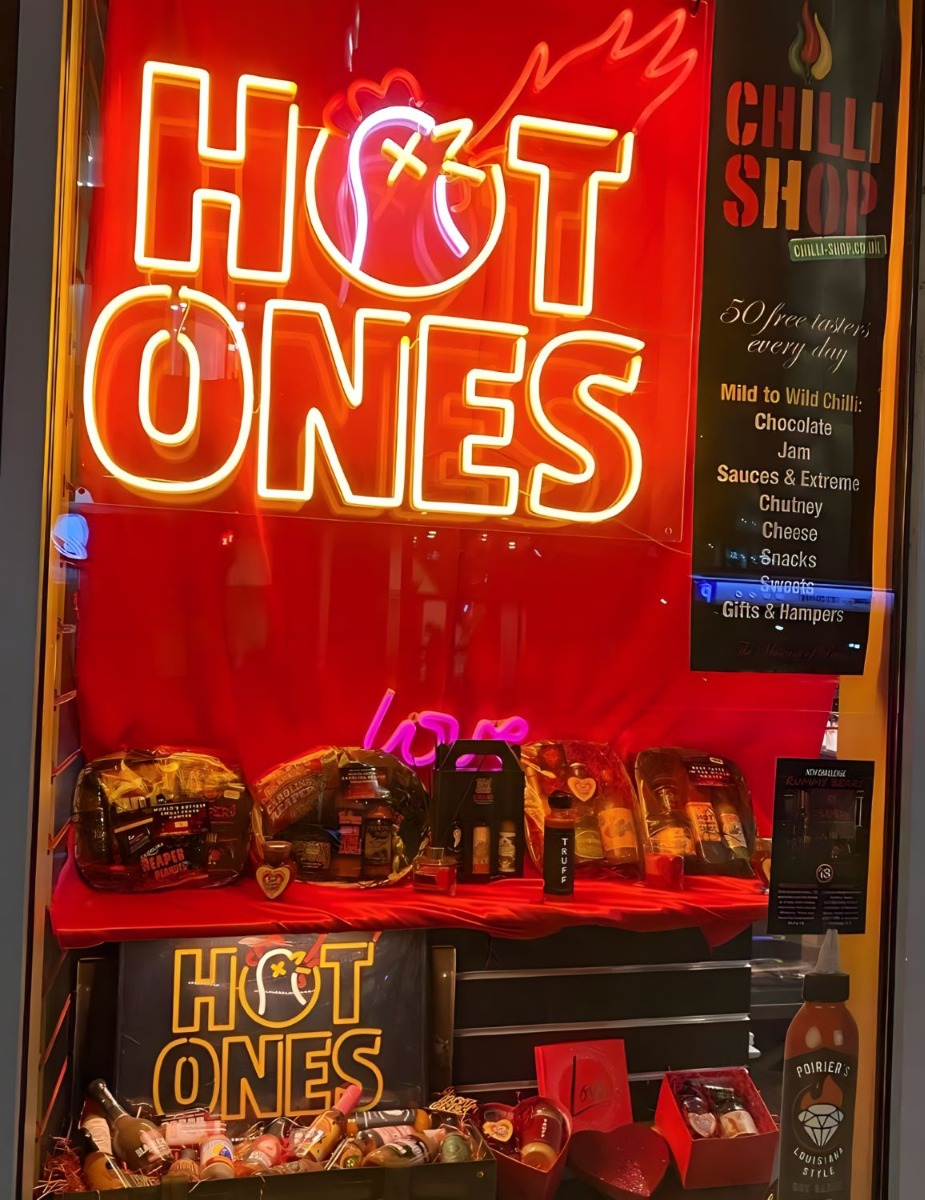 Custom Neon® Hot Ones brand sign in the shop front window @thechillishop