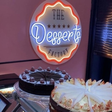 Multicoloured Custom Neon® logo bakery sign @thedessertsfactory_idn