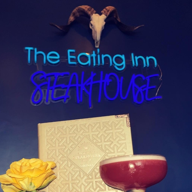 Blue Custom Neon® restaurant name sign @theeatinginnsteakhouse