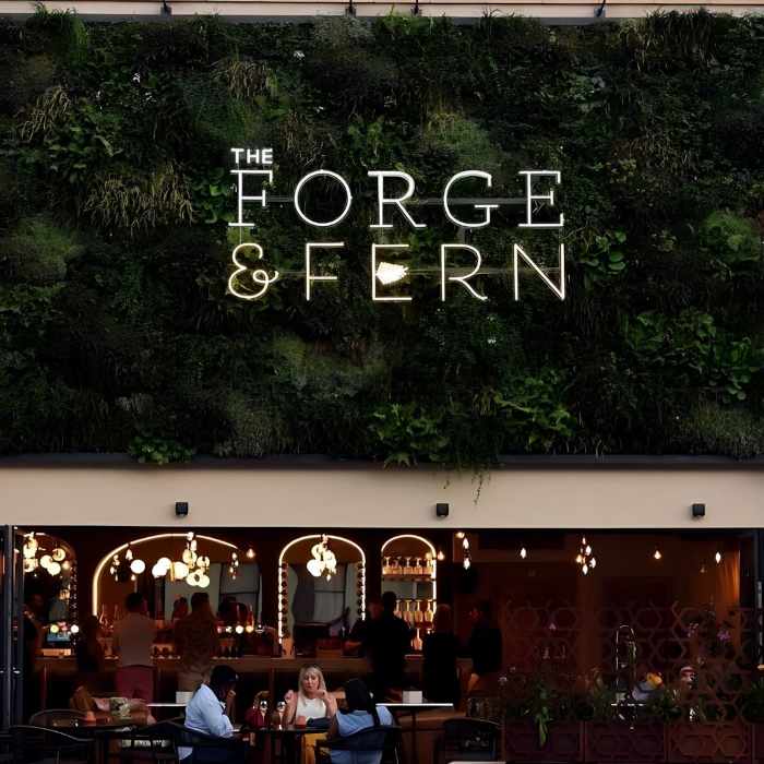Outdoor green wall restaurant logo sign by Custom Neon® @theforgeandfern