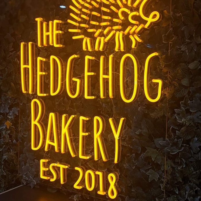 Yellow bakery established sign by Custom Neon® @thehedgehogbakery