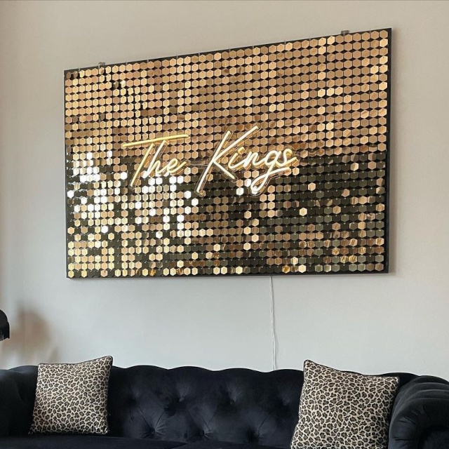 Warm white Custom Neon® word sign on shimmer wall @kingsathome