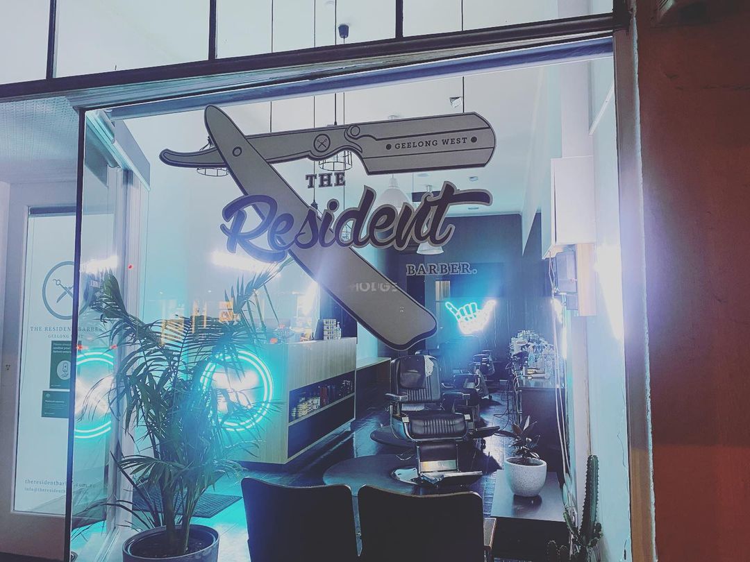 The Resident Barber shopfront showing light signs made by Custom Neon®