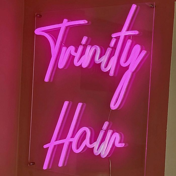 Trinity Hair hot pink Custom Neon® sign on the wall @trinityhairandbeautynotts