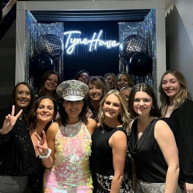 Tyne House white Custom Neon® photo booth sign with hen party guests posing @tynehouse in Newcastle UK