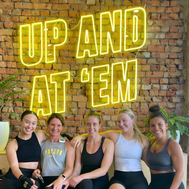 Up And At Em large yellow Custom Neon® quote sign on brick wall @upstate_studios