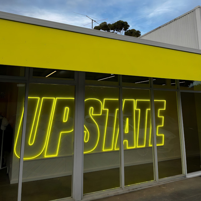 Custom Neon® fitness studio branded signage @upstate_studios