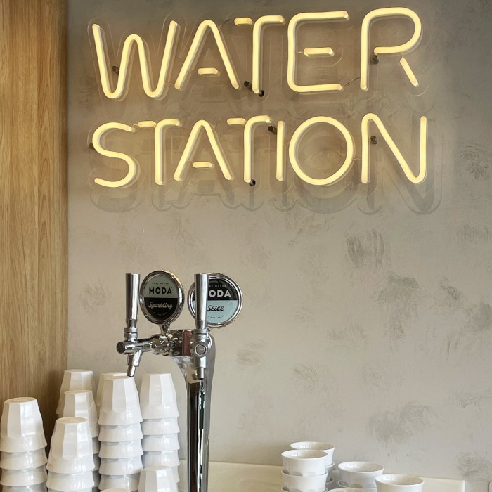 Water Station Custom Neon&reg; wayfinding sign at the @iloveyochi store