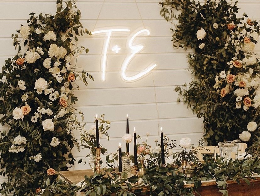 Custom Neon® wedding initials in warm white