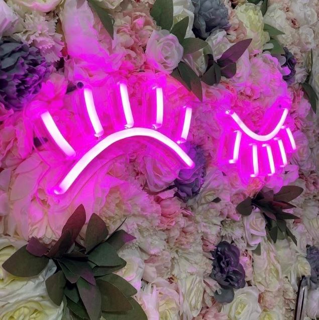 Wink Lashes pink LED neon art on flower wall - made by @customneon for @thebbeautyhub