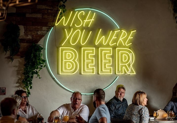 Large multicolored Custom Neon® quote sign in bar @o.creek.brewing