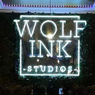 White tattoo studio logo sign @wolf_ink_studios made by Custom Neon®